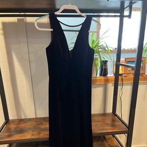 Nightway floor length black velvet dress, with a slit on leg.
